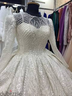 فستان زفاف اول لبسة ابيض