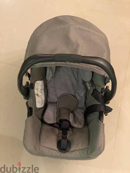 joie car seat 1st stage used in very good condition , gray color 3