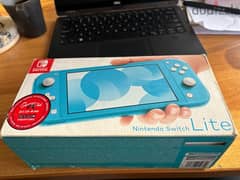 Nintendo Switch lite with original adapter and box