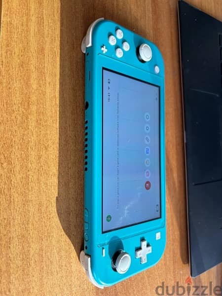 Nintendo Switch lite with original adapter and box 1