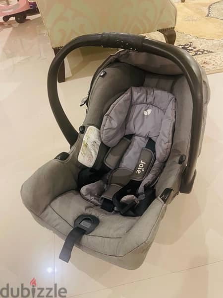 joie car seat 1st stage used in very good condition , gray color 9