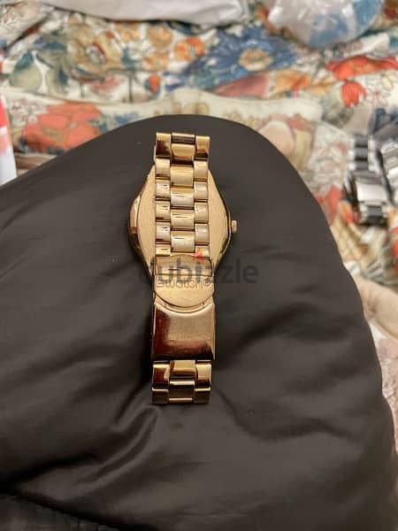swiss swatch watch,  gold color, rarely used, very good condition 1