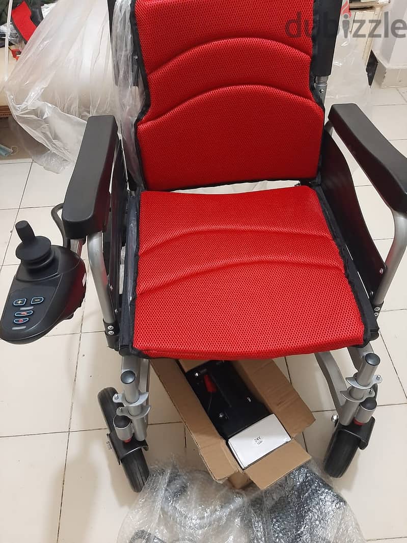 كرسي كهربائي متحرك جديد بالكرتونة 12