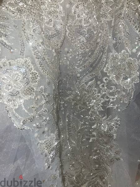 فستان زفاف لوزن ٥٠ ل٥٩ تصميم احمد فايز 6