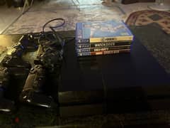 play station with 4 video games and 5 controllers (old controllers)