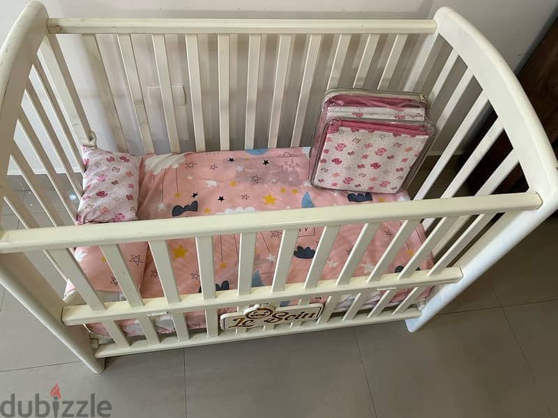 adjustable baby crib ( slightly used) 2