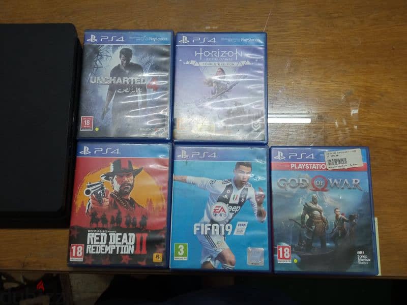 playstation 4 slim used 1TB with 5 games 2