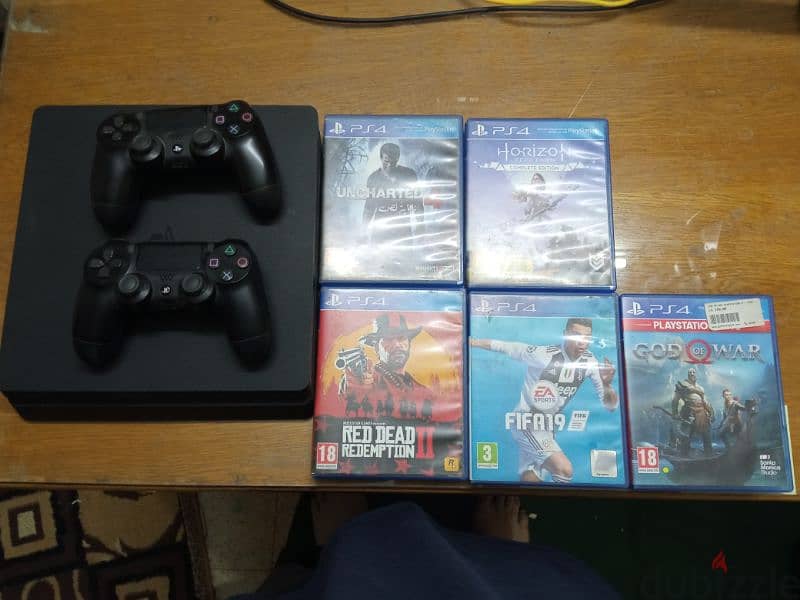 playstation 4 slim used 1TB with 5 games 3