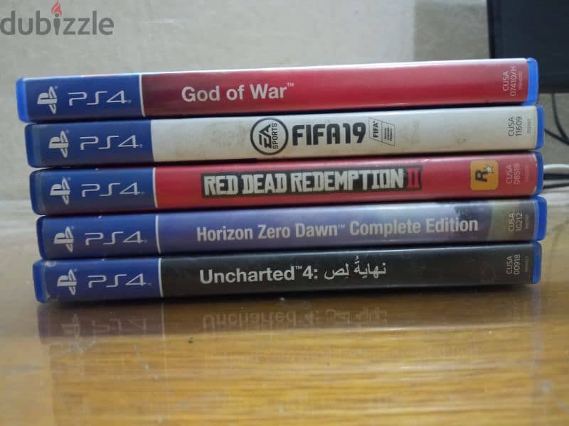 playstation 4 slim used 1TB with 5 games 9