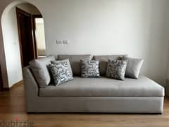 Sofa with mechanism for storage area