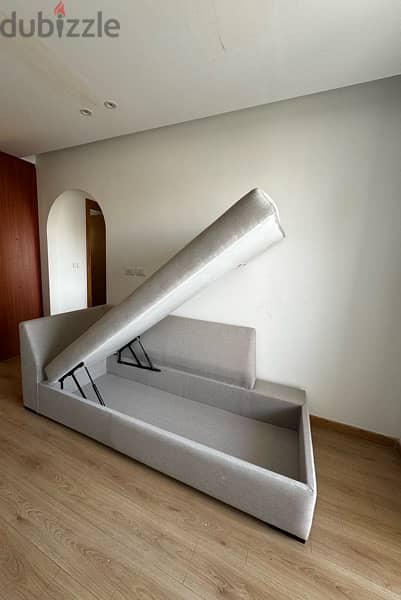 Sofa with mechanism for storage area 3