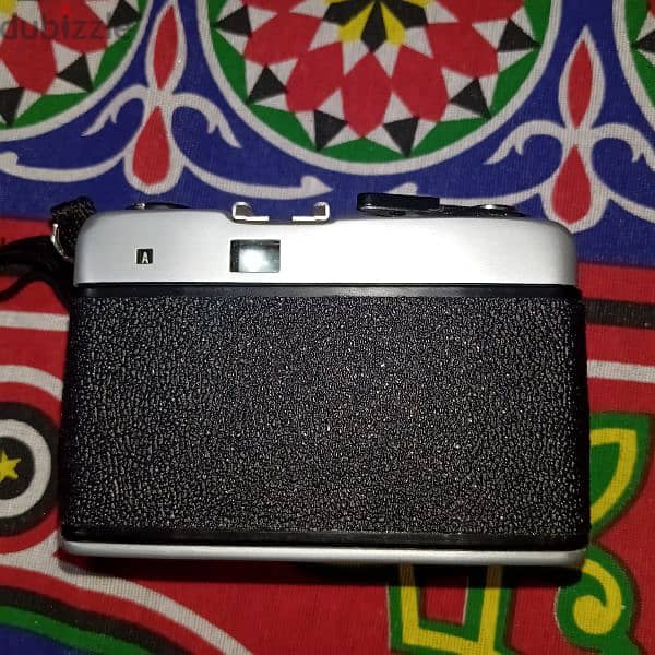 vintage camera with it's films and pictures cards 3
