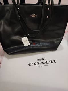 Brand new 100 % original double face coach handbag. 0