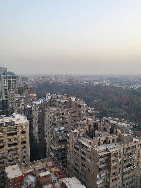 شقة رائعة بانوراما جامعة القاهرة وحديقة الحيوان ترى الأهرامات والنيل 15