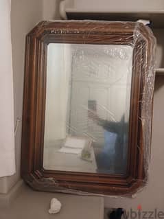 Mirror with wood frame