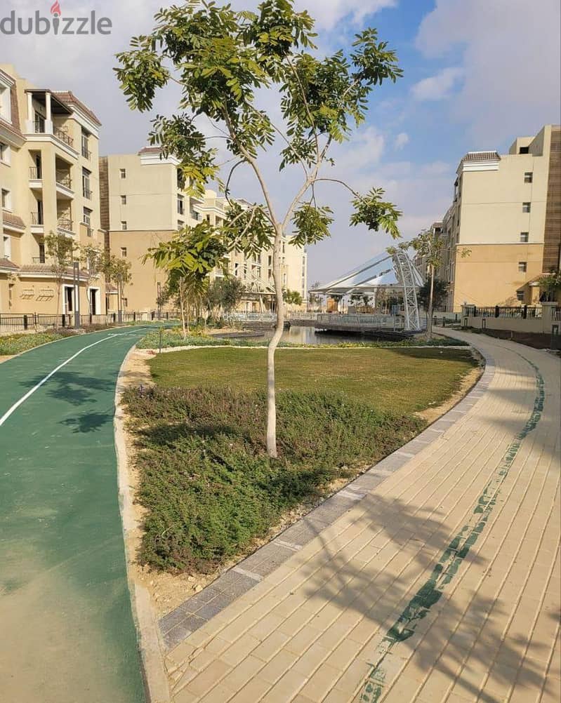 For sale, an apartment with a garden, 113 square meters, in front of the Capital Airport in New Cairo 1
