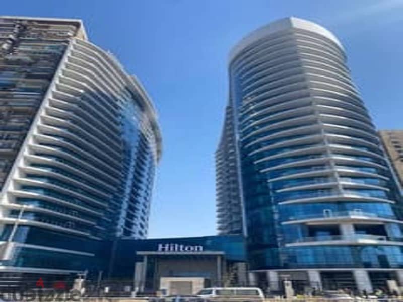 Ready to move to a fully finished hotel apartment with the services of a charming Hilton View on the Nile, Nile Pearl Towers 2