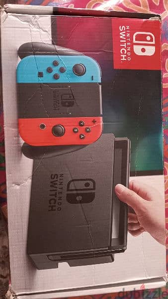 Nintendo switch blue and red used like new with the box 1