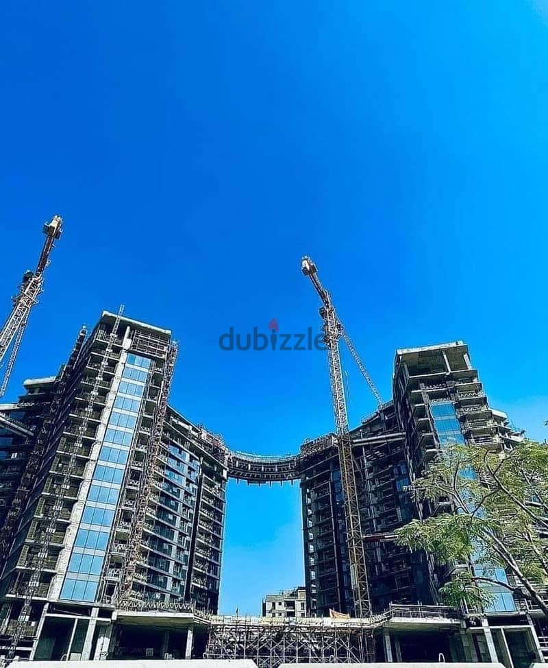 For sale, a hotel apartment with a fantastic view in Zed Towers, Fifth Settlement, with a down payment of 1.7, own it now 3