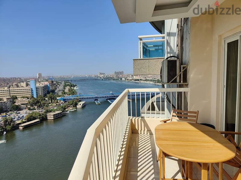 For sale, first row apartment on the Nile, immediate receipt, fully finished, in Nile Pearl Towers, managed by Hilton, in installments. 1
