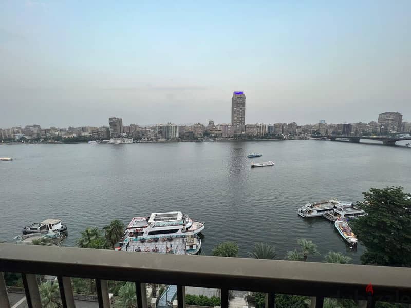 For sale, first row apartment on the Nile, immediate receipt, fully finished, in Nile Pearl Towers, managed by Hilton, in installments. 5