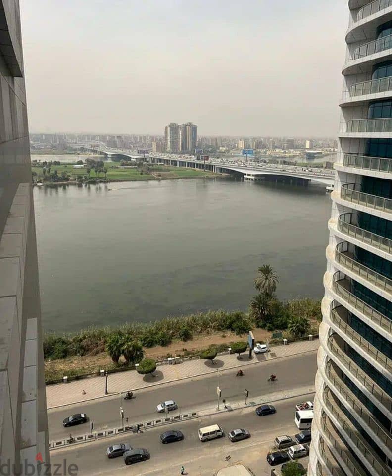 apartment with view directly on the Nile, ready to move , fully finished, with air conditioning, in the Nile Pearl Towers on the Corniche for sale 1