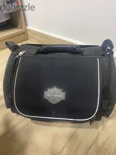 Detachable passenger backrest and travel bag
