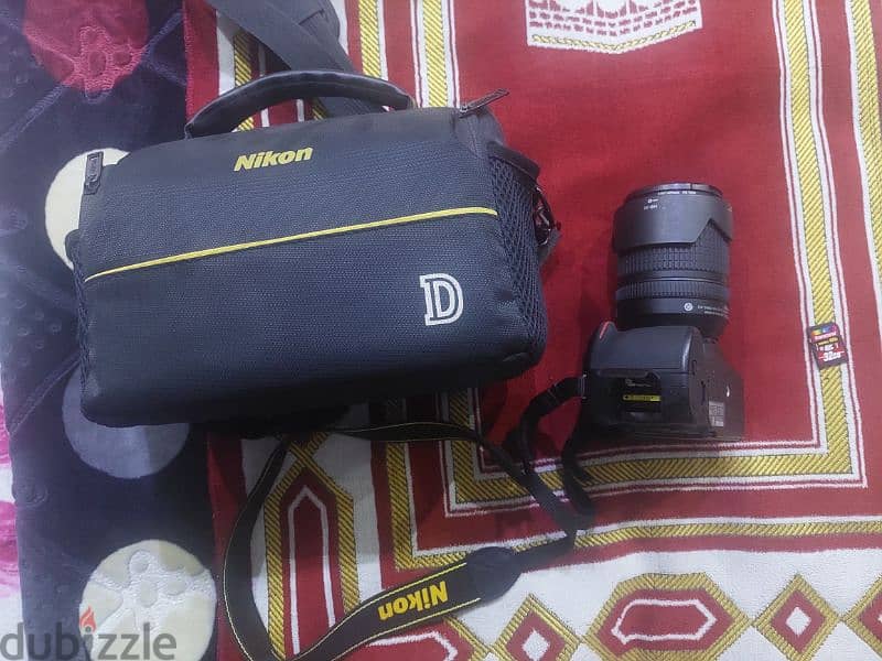 nikon d5200 with 18/140 lens used like new 2