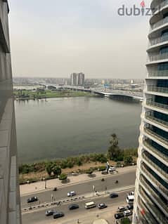 Ready to move luxurious apartment fantastic view on the Nile, ultra super luxurious finishing, with the services of the Hilton Nile Corniche Hotel 1