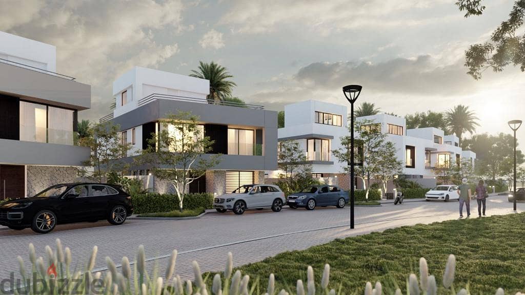 Townhouse 412 meters with garden 238 meters in a prime location on the Pool at a snapshot price in the most prestigious compound in New Mansoura with 6