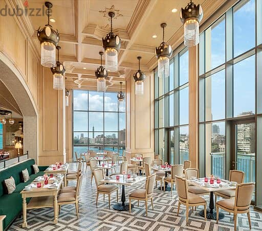 A 39-meter restaurant on the designated floor, food court, with a 10% discount, next to the stairs, a view of the Misr Mosque and the gold market, and 8