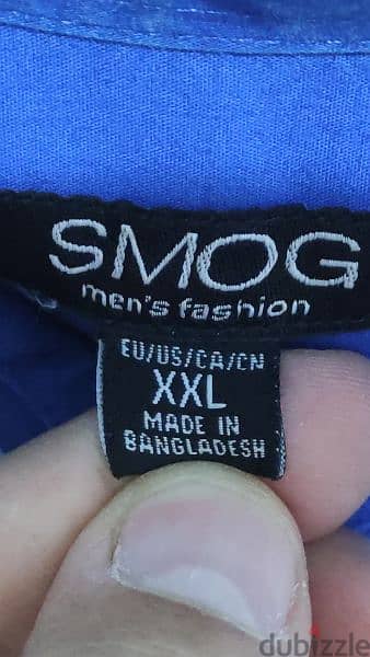 قميص SMUG من الإمارات 
صنع فى بنجلاديش 
مقاس XXL 
جديد لم يستخدم 1