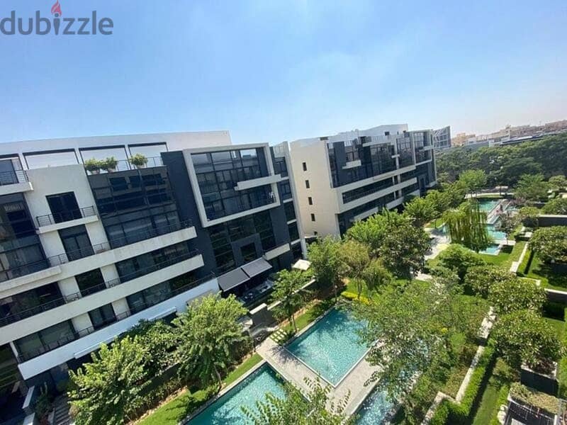 Apartment 203 + garden at a special price in Waterway New Cairo 2