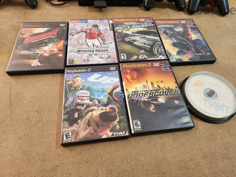 Playstation 2 + 4 controllers + games 2