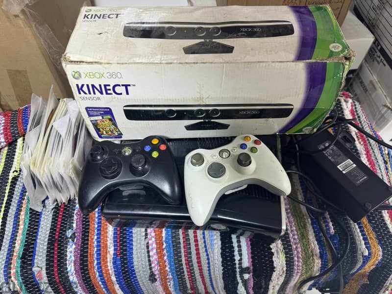 xbox 360 with kinect and 2 controllers and more than 50 cds 0