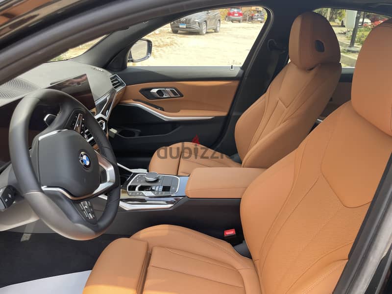 BMW 320i Luxury zero وكيل 3
