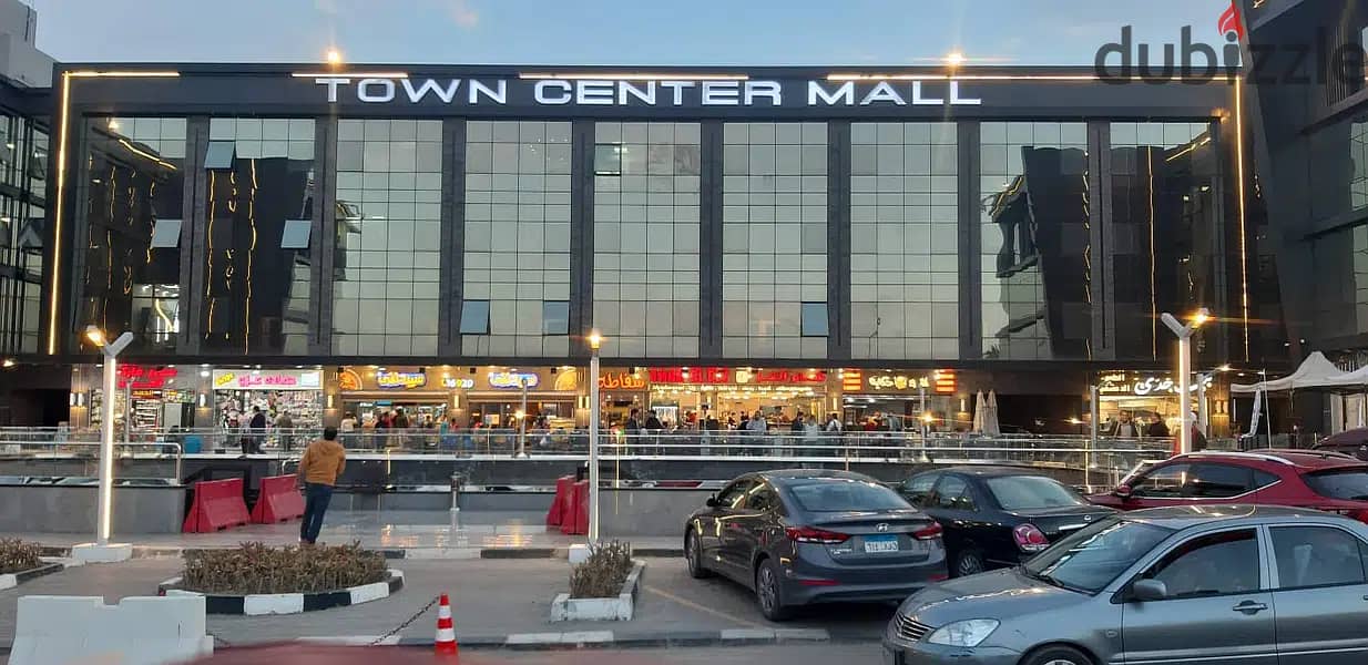 Shop for sale, 130 meters, on the ground floor, in the best mall in Shorouk City, in the Town Center Mall, next to Dar Misr, in installments. 1